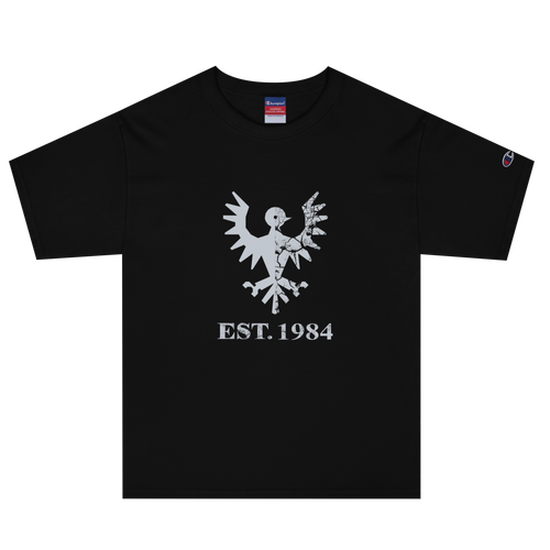 Black heavyweight, 100% cotton luxury Champion© t-shirt featuring aged falcon emblem and text "EST. 1984" indicating the year the faction was first introduced to the brick universe. Item is a BRKDrip Heritage Collection luxury shirt with a vintage castle building block aesthetic.
