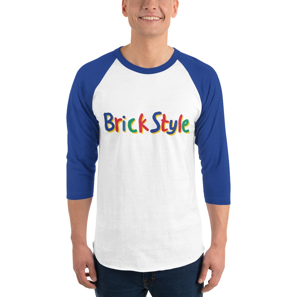 Fashionable male model wearing a white 100% cotton shirt with blue 3/4 length sleeves featuring parody AFOL slogan "Brick Style" in child-like block writing with letters alternating between blue, red, and green. Item is a BRKDrip retro collection baseball tee with a vintage building blocks aesthetic.
