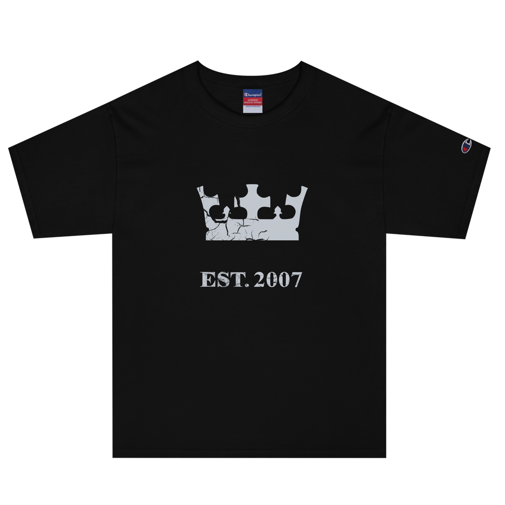 Black heavyweight, 100% cotton luxury Champion© t-shirt featuring aged crown emblem and text "EST. 2007" indicating the year the faction was first introduced to the brick universe. Item is a BRKDrip Heritage Collection luxury shirt with a vintage castle building block aesthetic.
