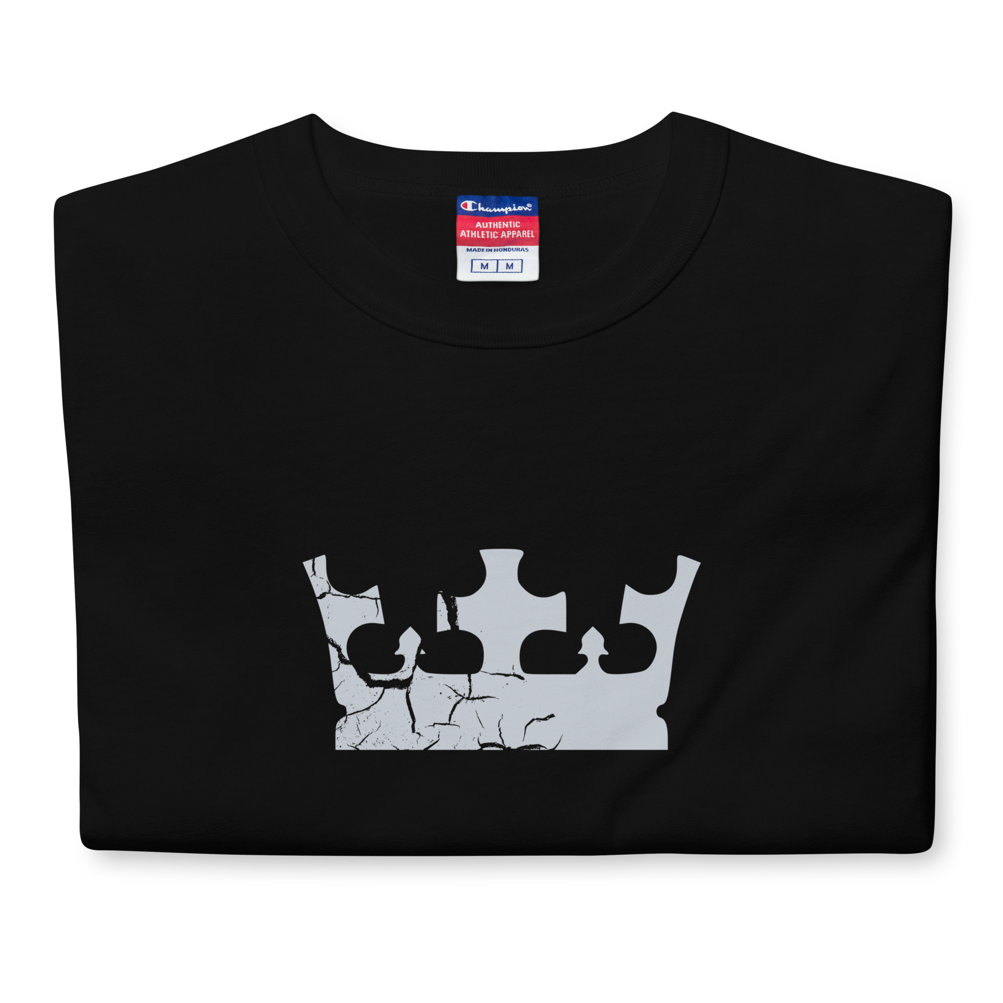 Folded black heavyweight, 100% cotton luxury Champion© t-shirt featuring aged crown emblem and text "EST. 2007" indicating the year the faction was first introduced to the brick universe. Item is a BRKDrip Heritage Collection luxury shirt with a vintage castle building block aesthetic.