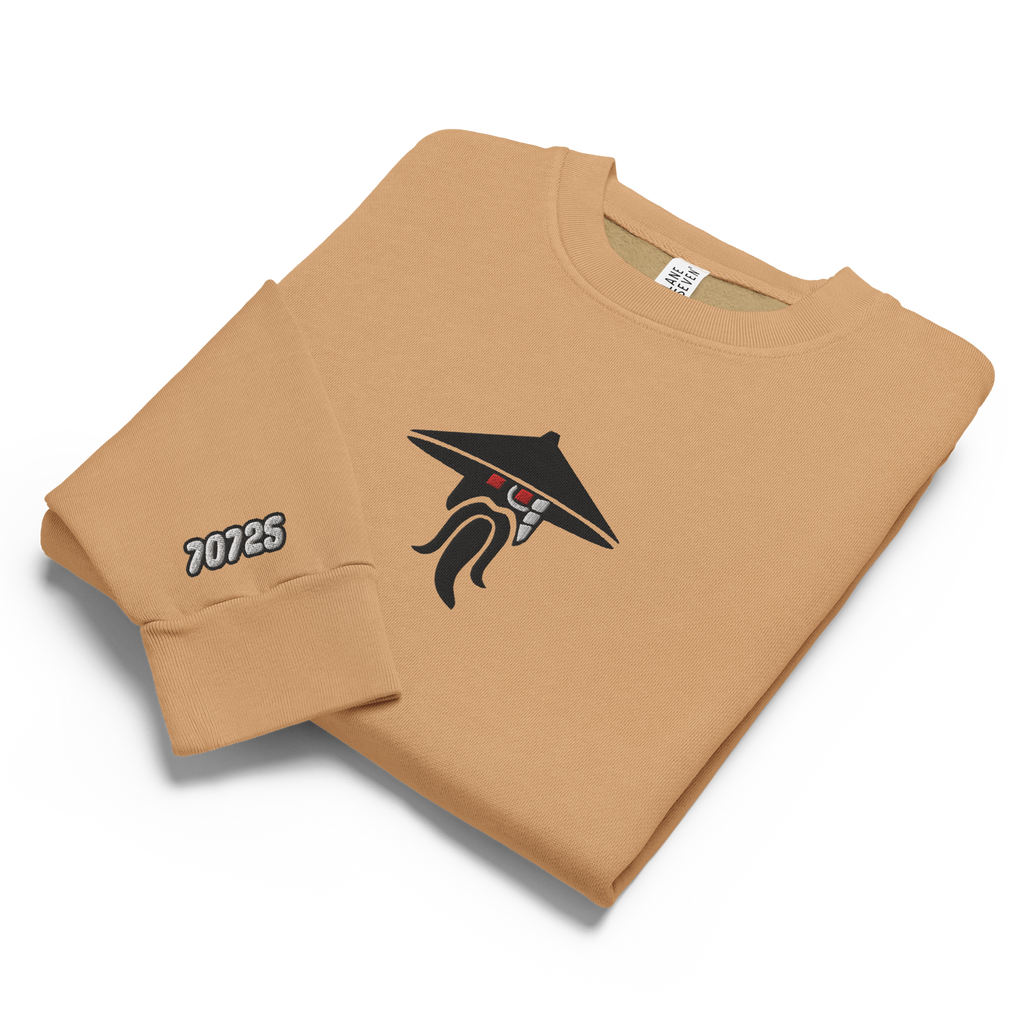 Burro brown tri-blend fleece sweatshirt featuring a classic fan-made evil sensei with red eyes design embroidered across the front and setshirt number 70725 on the sleeve. Item is a BRKDrip Limited Edition Cozy Wear Sweatshirt with a modern elemental brick master aesthetic.