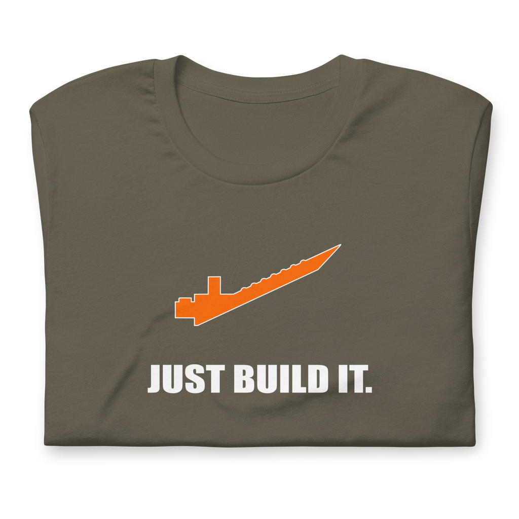 Folded army green 100% airlume cotton t-shirt featuring orange brick separator and parody AFOL saying: "Just Build It". Item is a BRKDrip AFOL essentials shirt with a modern brick-inspired aesthetic.