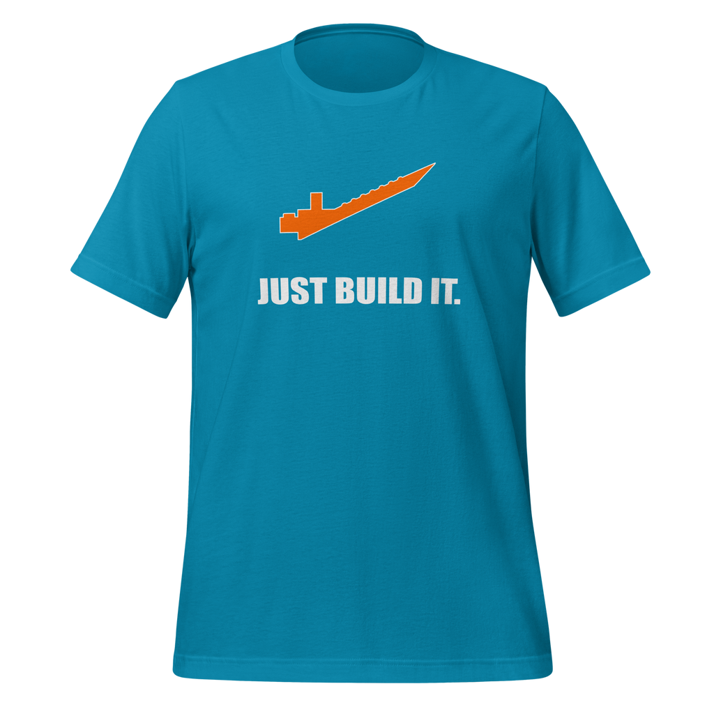 Aqua blue 100% airlume cotton t-shirt featuring orange brick separator and parody AFOL saying: "Just Build It". Item is a BRKDrip AFOL essentials shirt with a modern brick-inspired aesthetic.