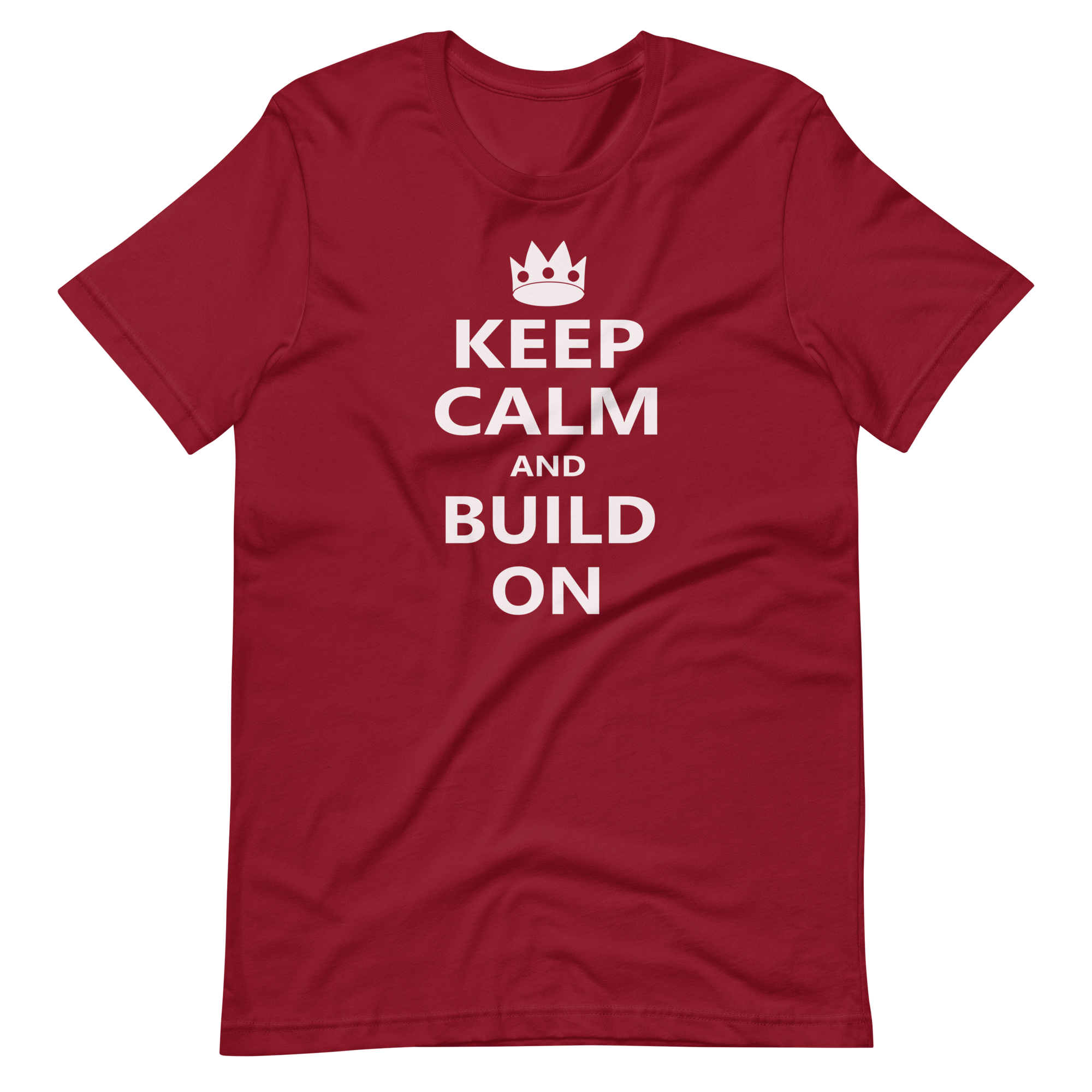 Wrinkled cardinal red 100% airlume cotton t-shirt featuring OG castle crown and parody AFOL saying: "Keep Calm and Build On". Item is a BRKDrip AFOL essentials shirt with a modern brick-inspired aesthetic.