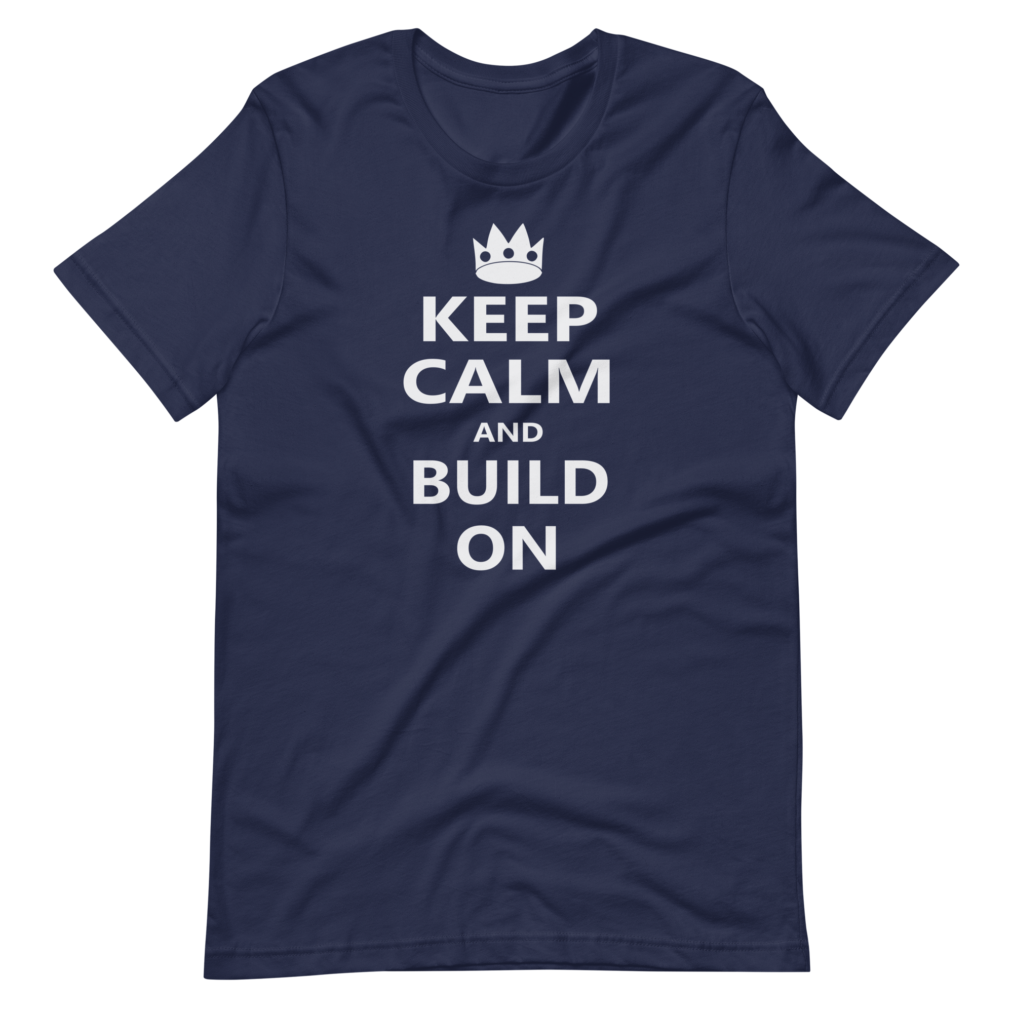 Wrinkled navy blue 100% airlume cotton t-shirt featuring OG castle crown and parody AFOL saying: "Keep Calm and Build On". Item is a BRKDrip AFOL essentials shirt with a modern brick-inspired aesthetic.