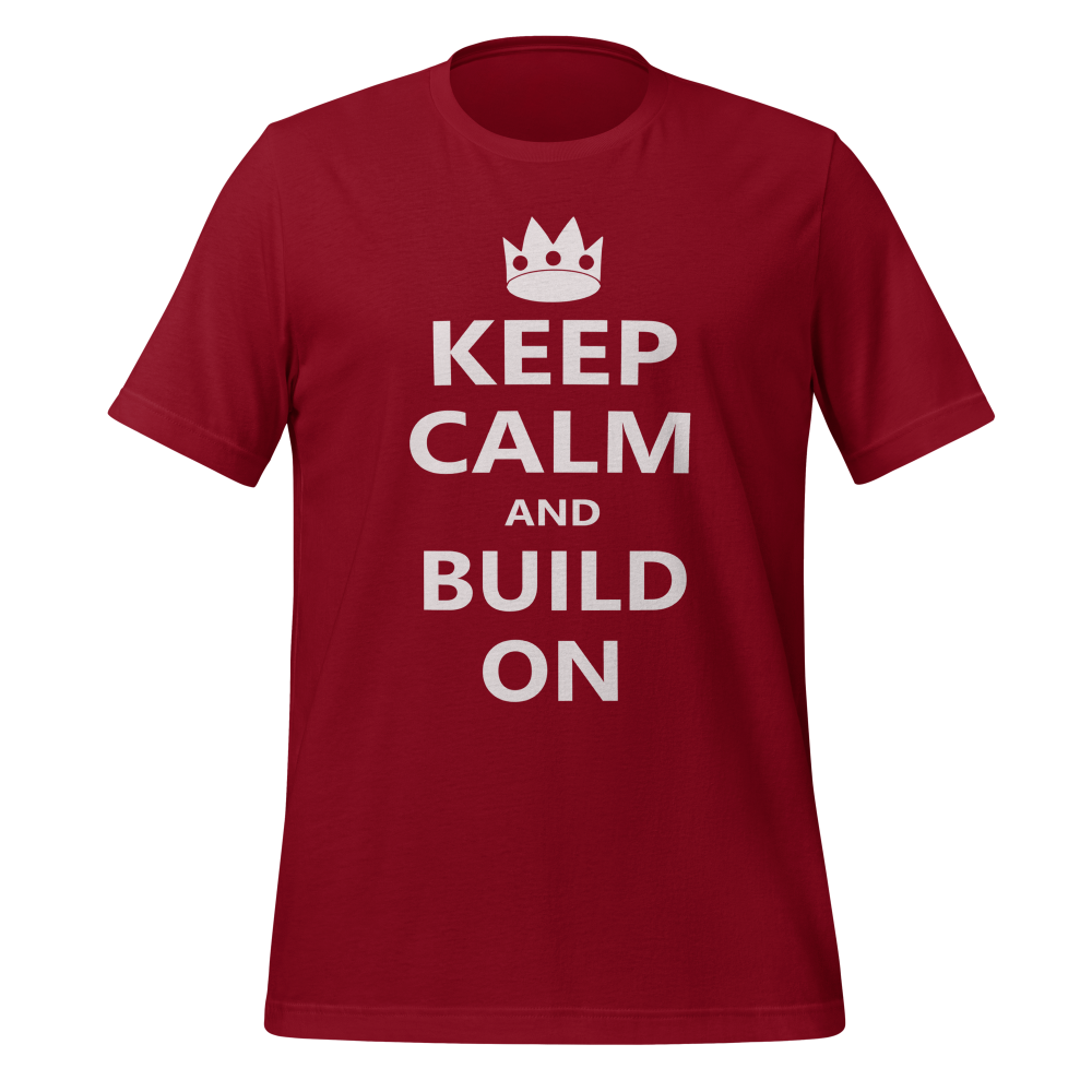 Cardinal red 100% airlume cotton t-shirt featuring OG castle crown and parody AFOL saying: "Keep Calm and Build On". Item is a BRKDrip AFOL essentials shirt with a modern brick-inspired aesthetic.