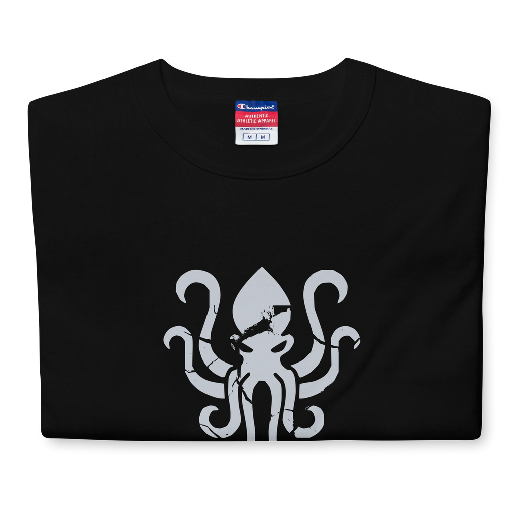 Folded Black heavyweight, 100% cotton luxury Champion© t-shirt featuring aged terrifying kraken sea monster emblem and text "EST. 2025" indicating the year the faction was first introduced to the brick universe. Item is a BRKDrip Heritage Collection luxury shirt with a vintage castle building block aesthetic.