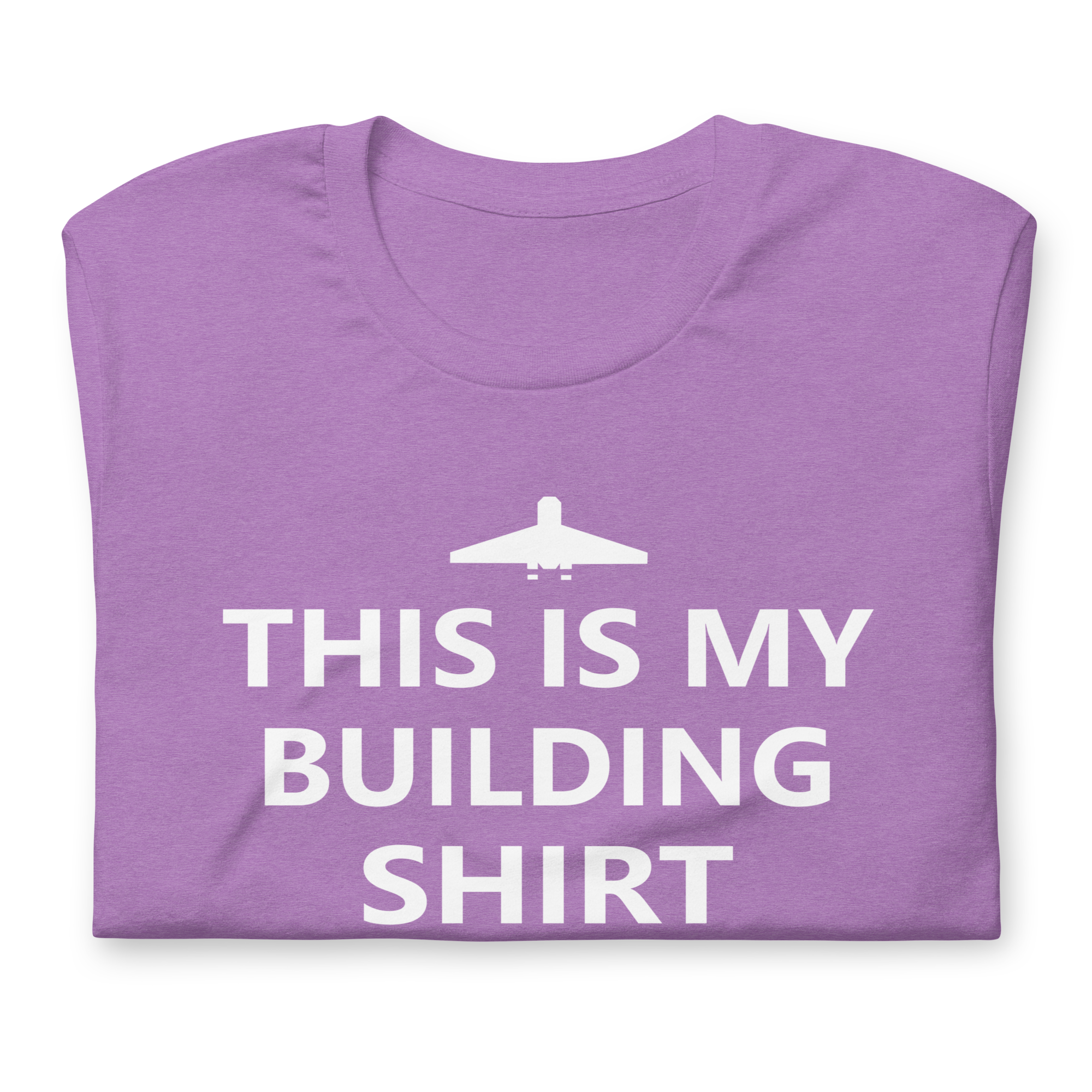Folded heather purple airlume cotton t-shirt featuring brick city airport logo and parody AFOL saying: "This is my Building Shirt". Item is a BRKDrip AFOL essentials shirt with a modern brick-inspired aesthetic.