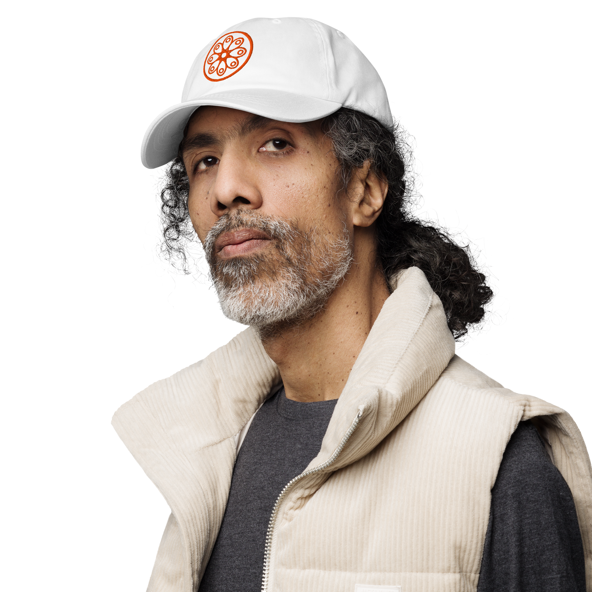 Fashionable male model wearing a white cotton twill baseball cap hat featuring embroidered orange sensei dojo logo design. Item is a BRKDrip AFOL Headgear Dad Hat with a modern elemental brick master aesthetic.