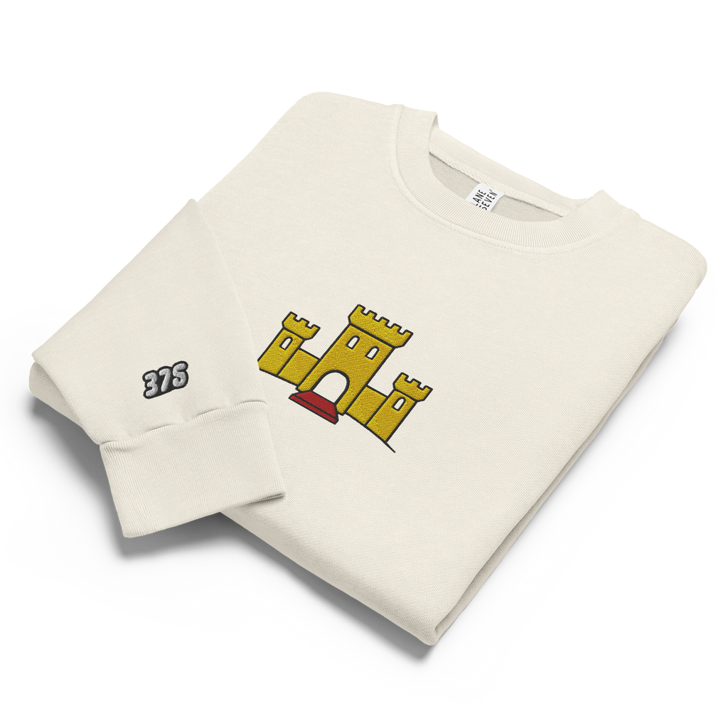 Off-white lunar rock tri-blend fleece sweatshirt featuring a classic fan-made OG yellow castle design embroidered across the front and setshirt number 375 on the sleeve. Item is a BRKDrip Limited Edition Cozy Wear Sweatshirt with a vintage castle building blocks aesthetic.