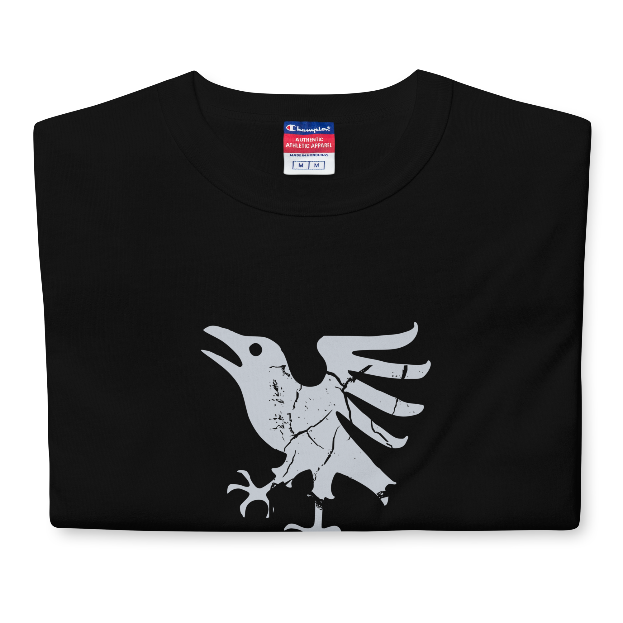 Folded black heavyweight, 100% cotton luxury Champion© t-shirt featuring aged raven emblem and text "EST. 2020" indicating the year the faction was first introduced to the brick universe. Item is a BRKDrip Heritage Collection luxury shirt with a vintage castle building block aesthetic.