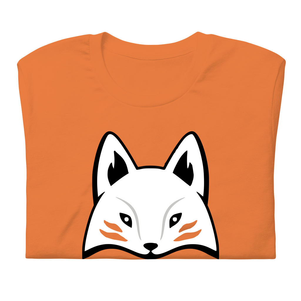 Folded orange 100% airlume cotton t-shirt featuring modern red kitsune mask design. Item is a BRKDrip AFOL essentials shirt with a modern elemental brick masters aesthetic.