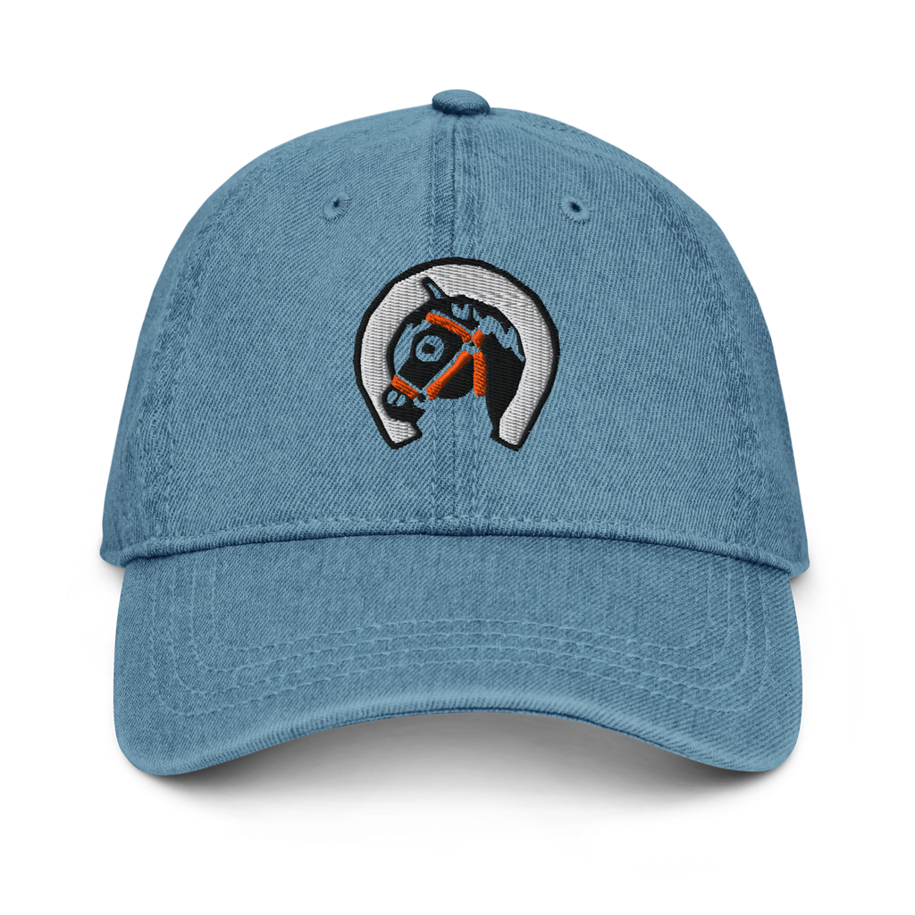 Front-facing view of denim dark blue cotton baseball cap hat featuring embroidered sunset stables ranch design. Item is a BRKDrip AFOL Headgear Dad Hat with a modern town building blocks aesthetic.
