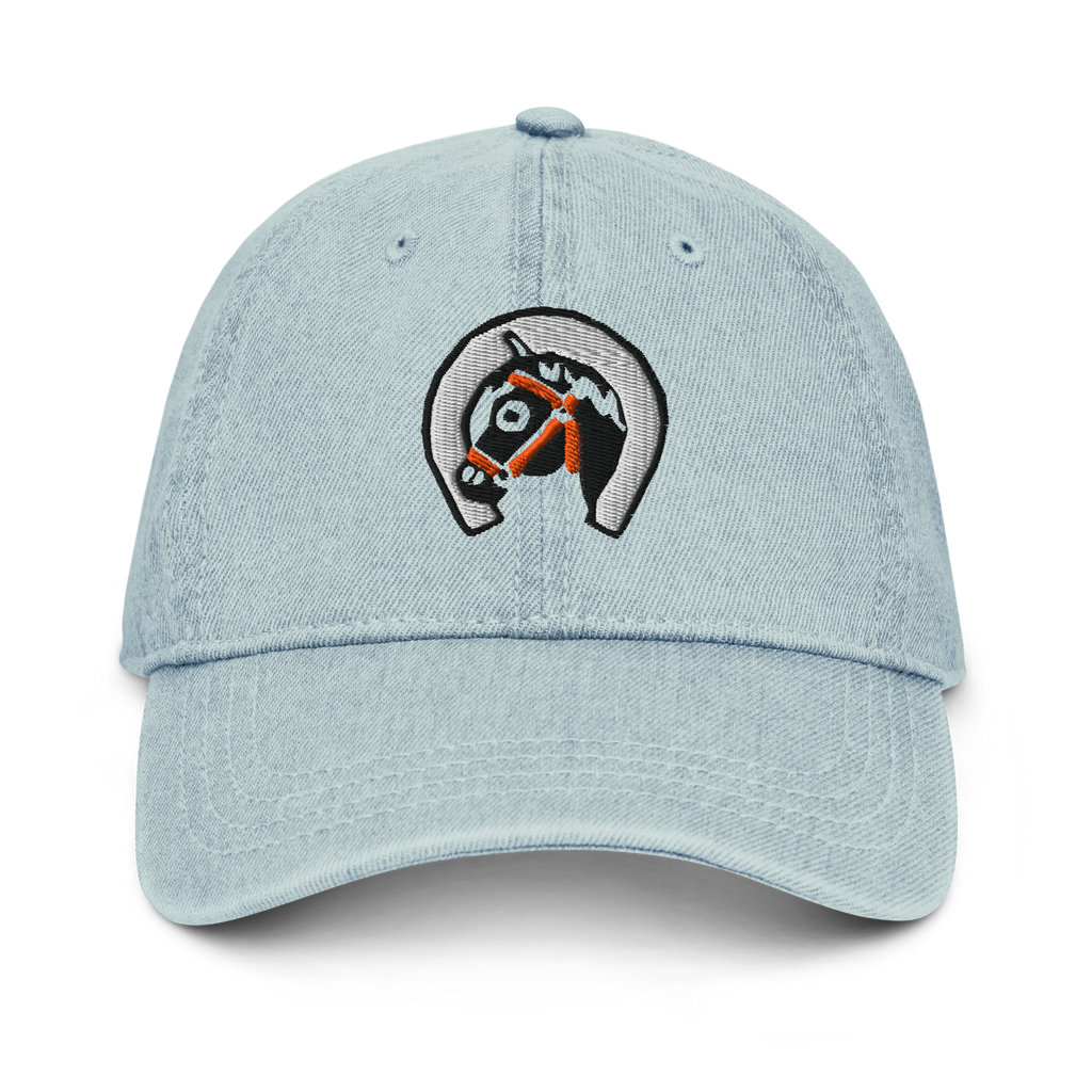 Front-facing view of denim light blue cotton baseball cap hat featuring embroidered sunset stables ranch design. Item is a BRKDrip AFOL Headgear Dad Hat with a modern town building blocks aesthetic.