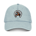 Front-facing view of denim light blue cotton baseball cap hat featuring embroidered sunset stables ranch design. Item is a BRKDrip AFOL Headgear Dad Hat with a modern town building blocks aesthetic.