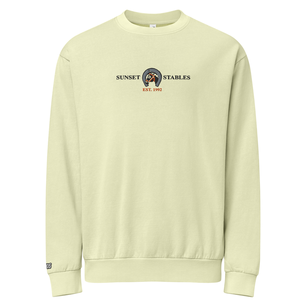 Hanging pistachio-colored tri-blend fleece sweatshirt featuring a classic fan-made sunset stables ranch design embroidered across the front and setshirt number 6405 on the sleeve. Item is a BRKDrip Limited Edition Cozy Wear Sweatshirt with a classic town building blocks aesthetic.