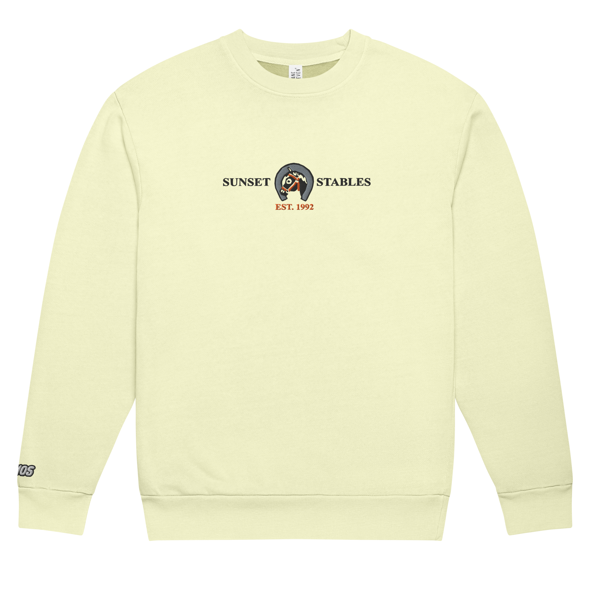 Flat pistachio-colored tri-blend fleece sweatshirt featuring a classic fan-made sunset stables ranch design embroidered across the front and setshirt number 6405 on the sleeve. Item is a BRKDrip Limited Edition Cozy Wear Sweatshirt with a classic town building blocks aesthetic.